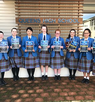 Queen's High School Languages - Queen's girls holding language certificates